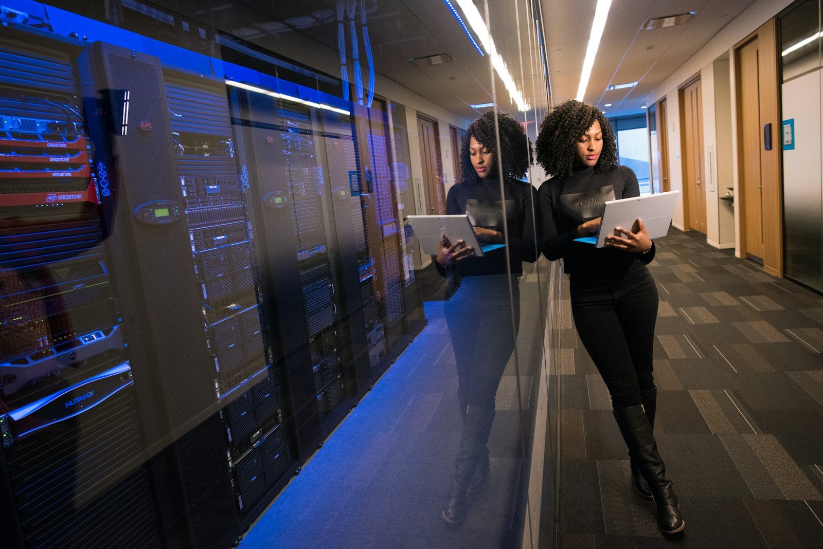 Engineer working among server infrastructure